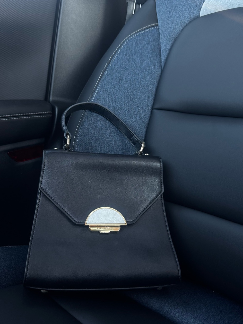BCBGMaxAzria Black Mini Top-Handle Bag with Gold Accent